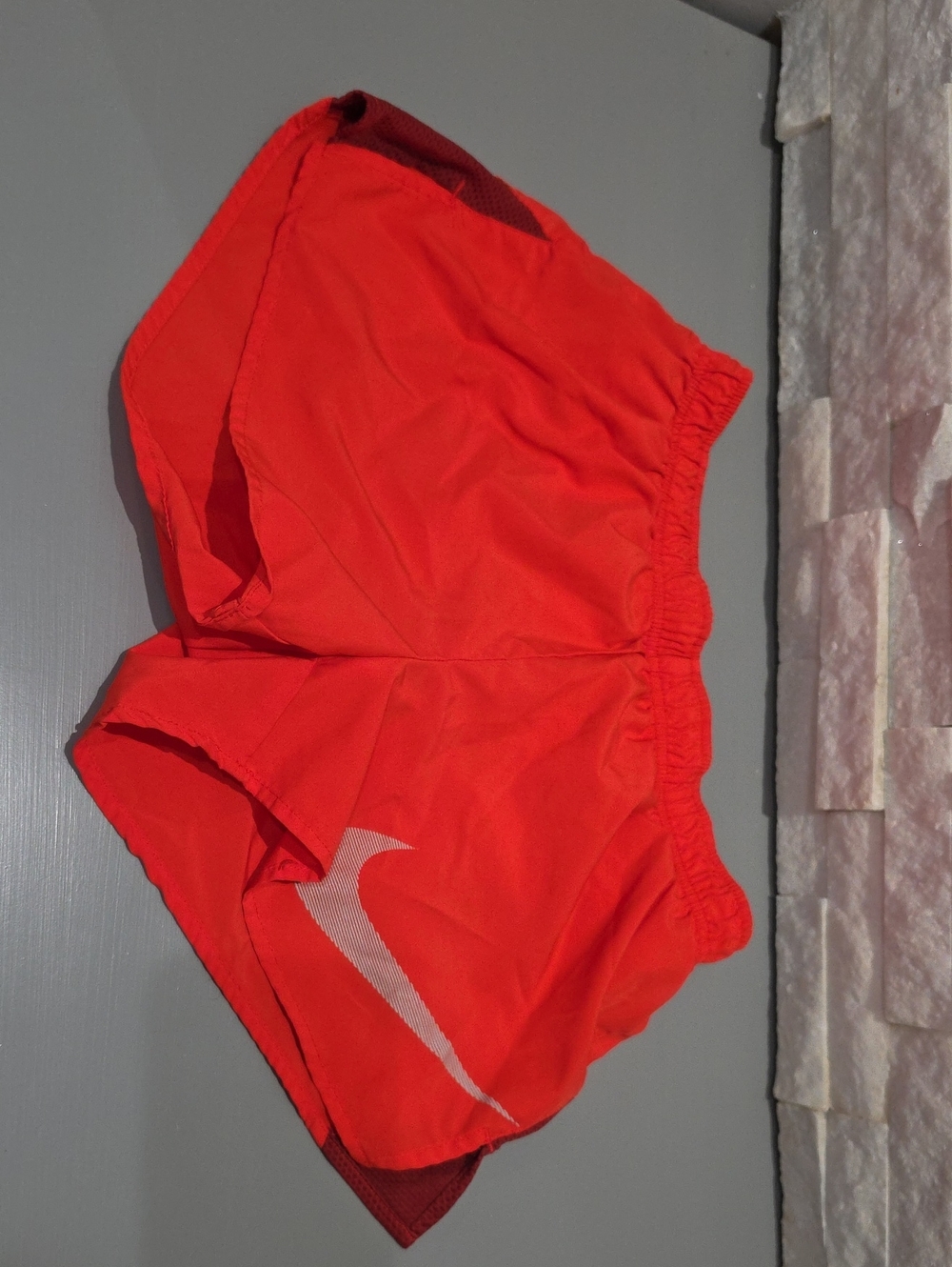 Nike Women's Red Athletic Running Shorts with White Swoosh